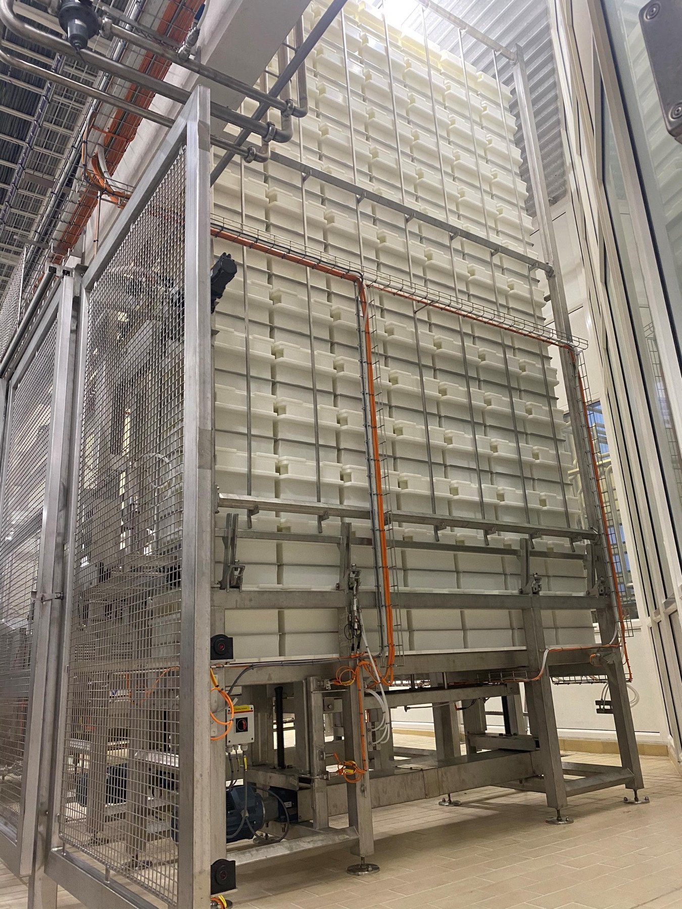 Rack system with cheeses in an existing ripening plant.