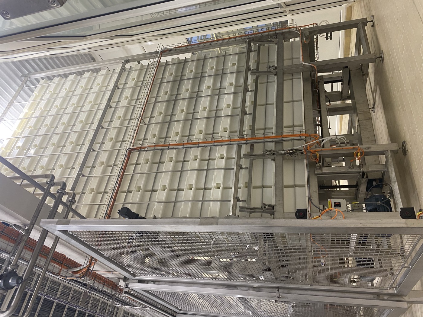 Automatic mold storage for cheese molds.